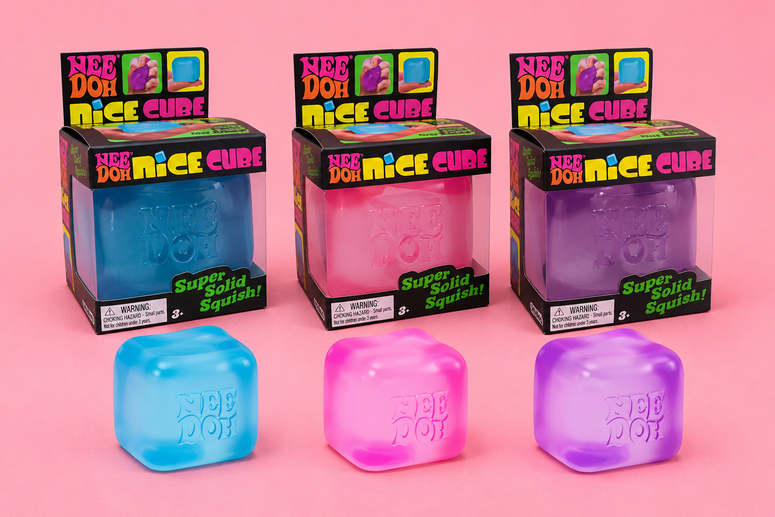 Pastel NeeDoh squishy cubes in blue pink and purple on pink background