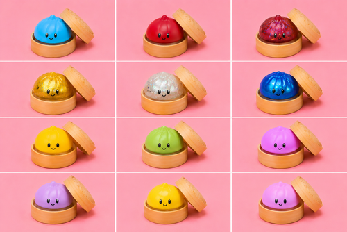 Colorful squishy dumpling sensory toys stacked together on pink background